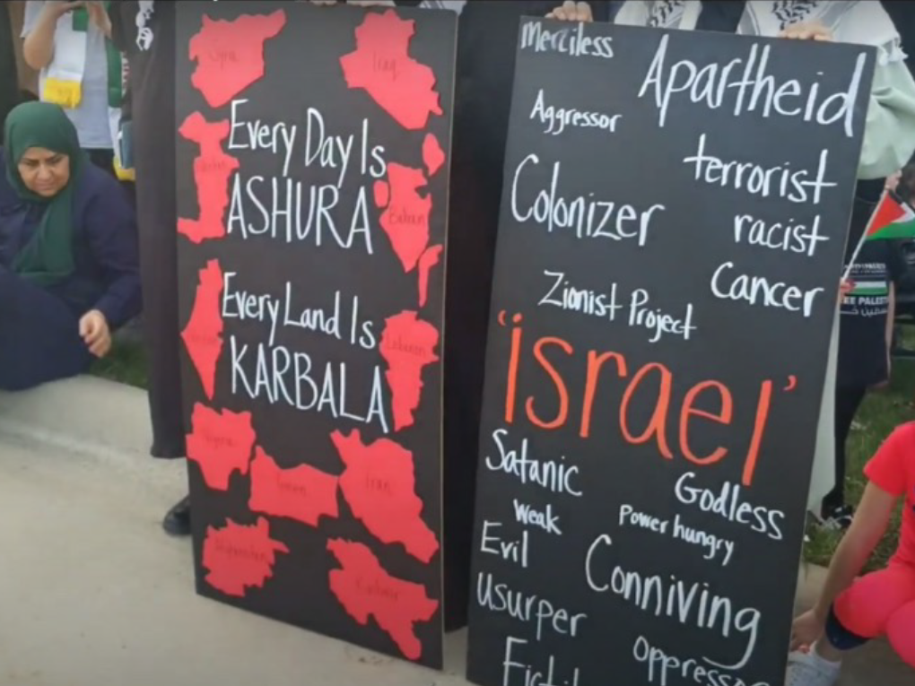 A sign with words depicting Israel negatively