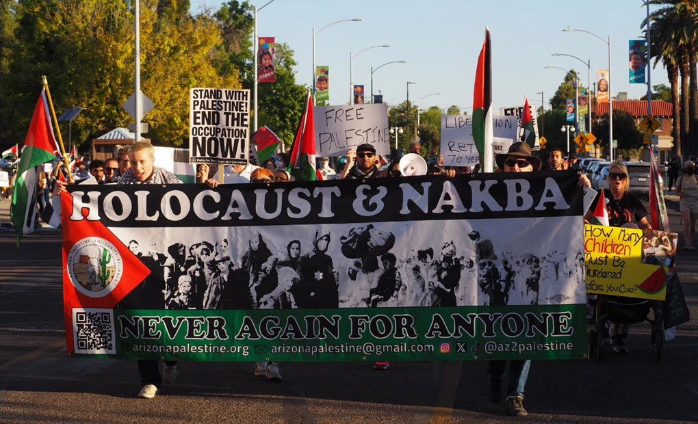 Protesters carry a banner referencing the Holocaust while commemorating Nakba Day during a march in Tucson, AZ on May 18, 2024. (source: Instagram)