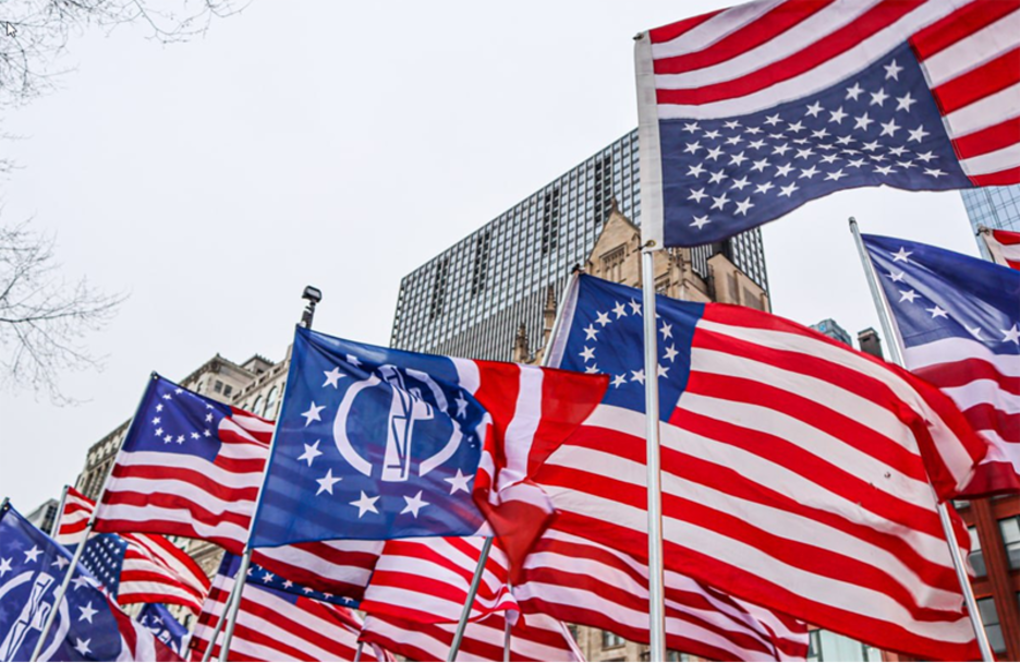 Upside down American flags, Betsy Ross flags and flags with the fasces symbol displayed during a Patriot Front demonstration in Chicago, Illinois - February 2022. Source: Telegram. 