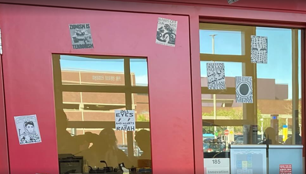 In this May 2024 screenshot at Colorado State University Encampment’s “Rally for Rafah” that DSA Fort Collins co-sponsored, protesters displayed stickers that included depictions of Popular Front for the Liberation of Palestine (PFLP) terrorist Leila Khaled as well as messages that included: “Zionism is terrorism.”