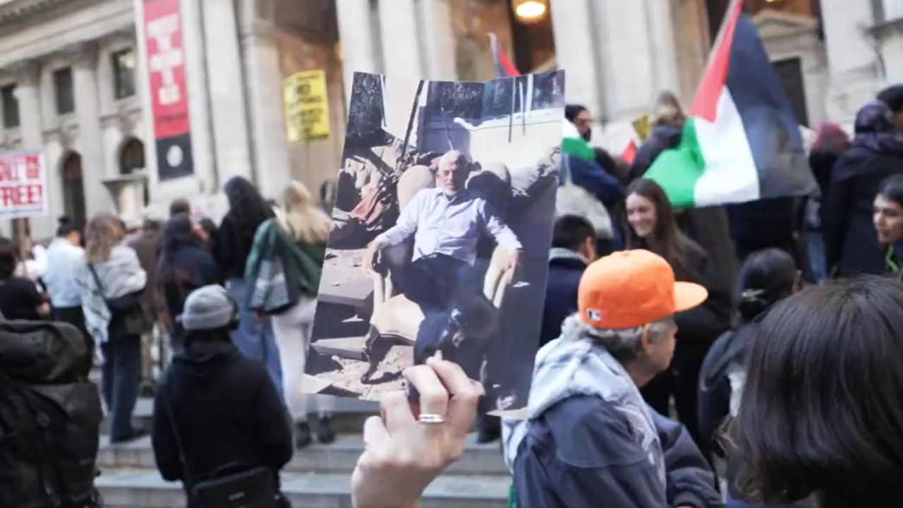 An anti-Israel protester displays a photograph of Hamas leader Yahya Sinwar in New York, NY, on October 18, 2024, two days after he was killed by Israeli military forces in Gaza.