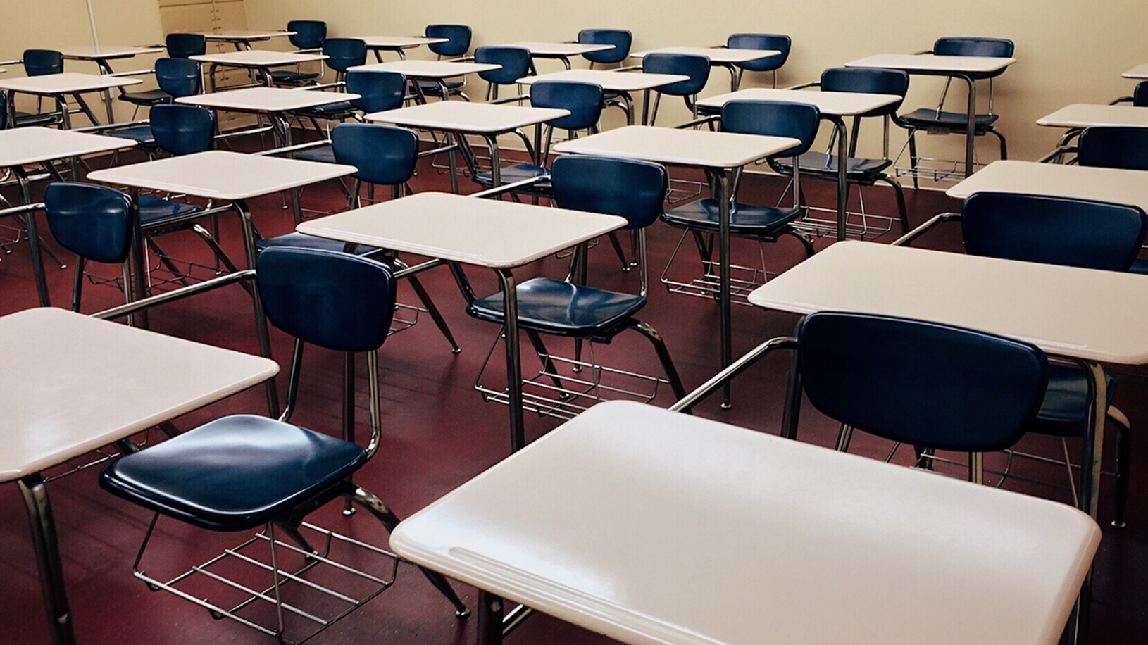 Education classroom rows of desk chairs