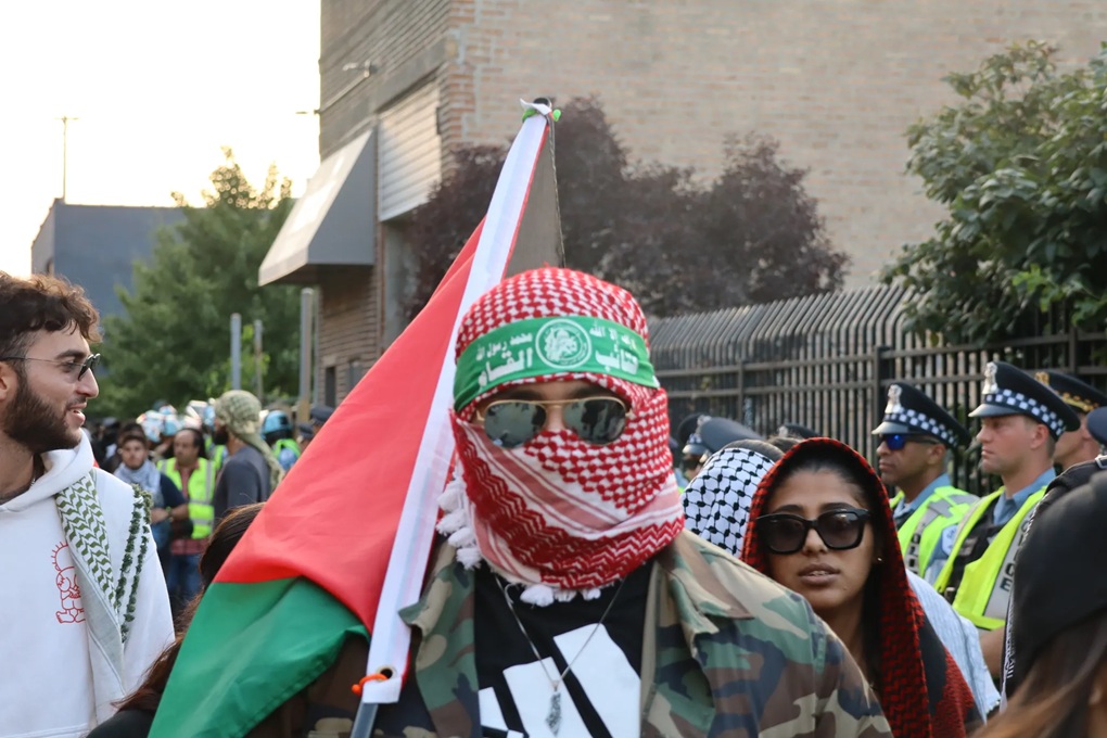 An image of a protestor wearing a Hamas headband at an AMP-sponsored rally outside of the Democratic National Convention, August 2024.(©ADL)