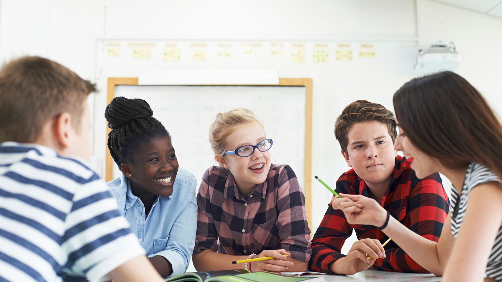 Students talking together at a table