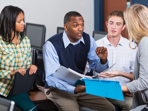 African American Male Teacher with Students in Class