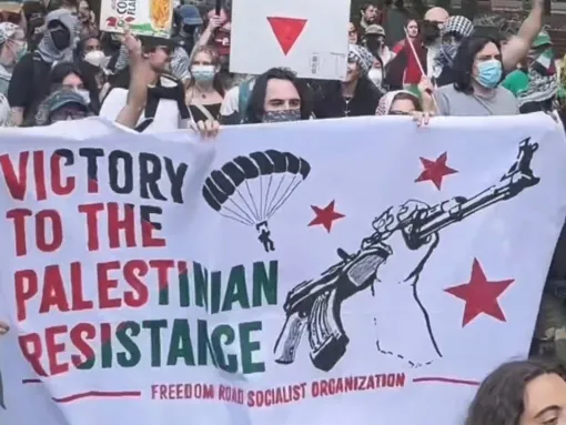 Protesters on the campus of Drexel University in Philadelphia, PA, celebrate Hamas’s October 7, 2023, attack on Israel one year later by carrying a banner that reads “Victory to the Palestinian Resistance” alongside paraglider and weapons imagery.