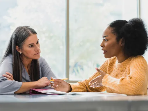 Teacher and College Student Talking