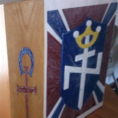 Symbol of Divine Truth Ministries, left, and Aryan Nations, right